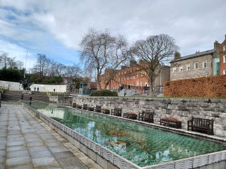 The calm water of the pool sit in the centre of this concrete garden