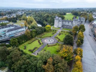 aerial view of the castle, the gardens, and city outside of the enclosure
