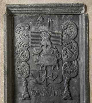 a panel on the wall that marks the tomb of a member of the O'Malley family