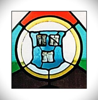 image of three castles inside a blue shield on stained glass
