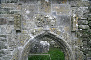 detailing etched into the stone above one of the arched windows of the church